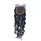 Natural curly 4x4 virgin human hair closure in natural black with transparent base.