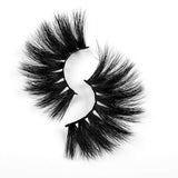 Dramatic 5D mink eyelashes with thick, voluminous design placed on a white background.