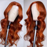 Orange ginger body wave lace wig on mannequin, 13x4 transparent frontal.