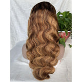 Honey blonde body wave wig with highlights and transparent frontal lace.