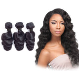 Loose wave virgin human hair bundles with natural black curls.