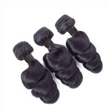 Loose wave virgin human hair bundles in natural black color.