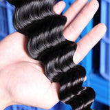 Loose deep curly virgin human hair bundle in natural black with defined curl pattern.