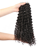 Deep wave virgin human hair tape-in extensions in natural black.